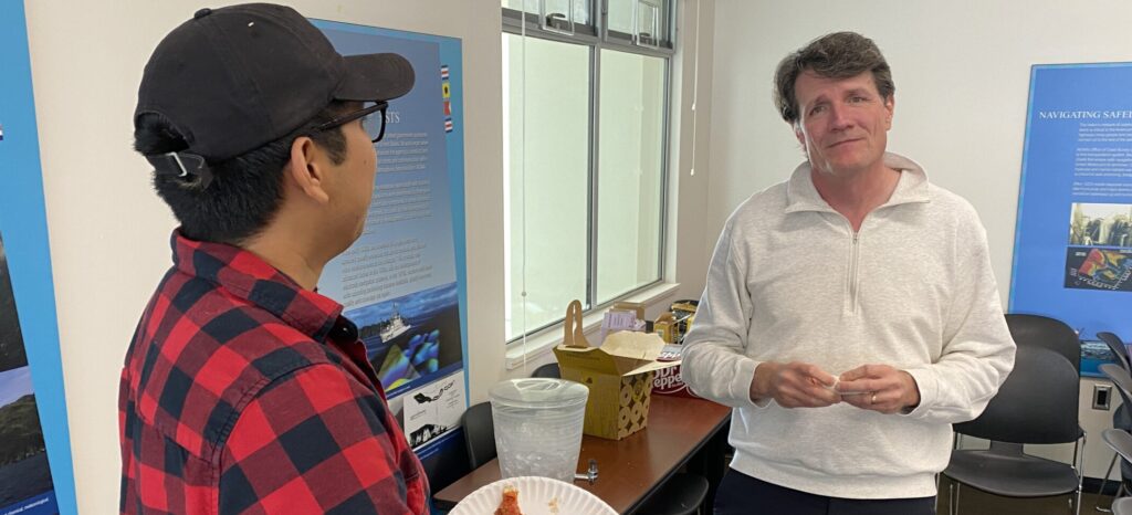 Spencer and Max chatting over lunch during the second day of our Phase 1 kickoff meeting. May 2023